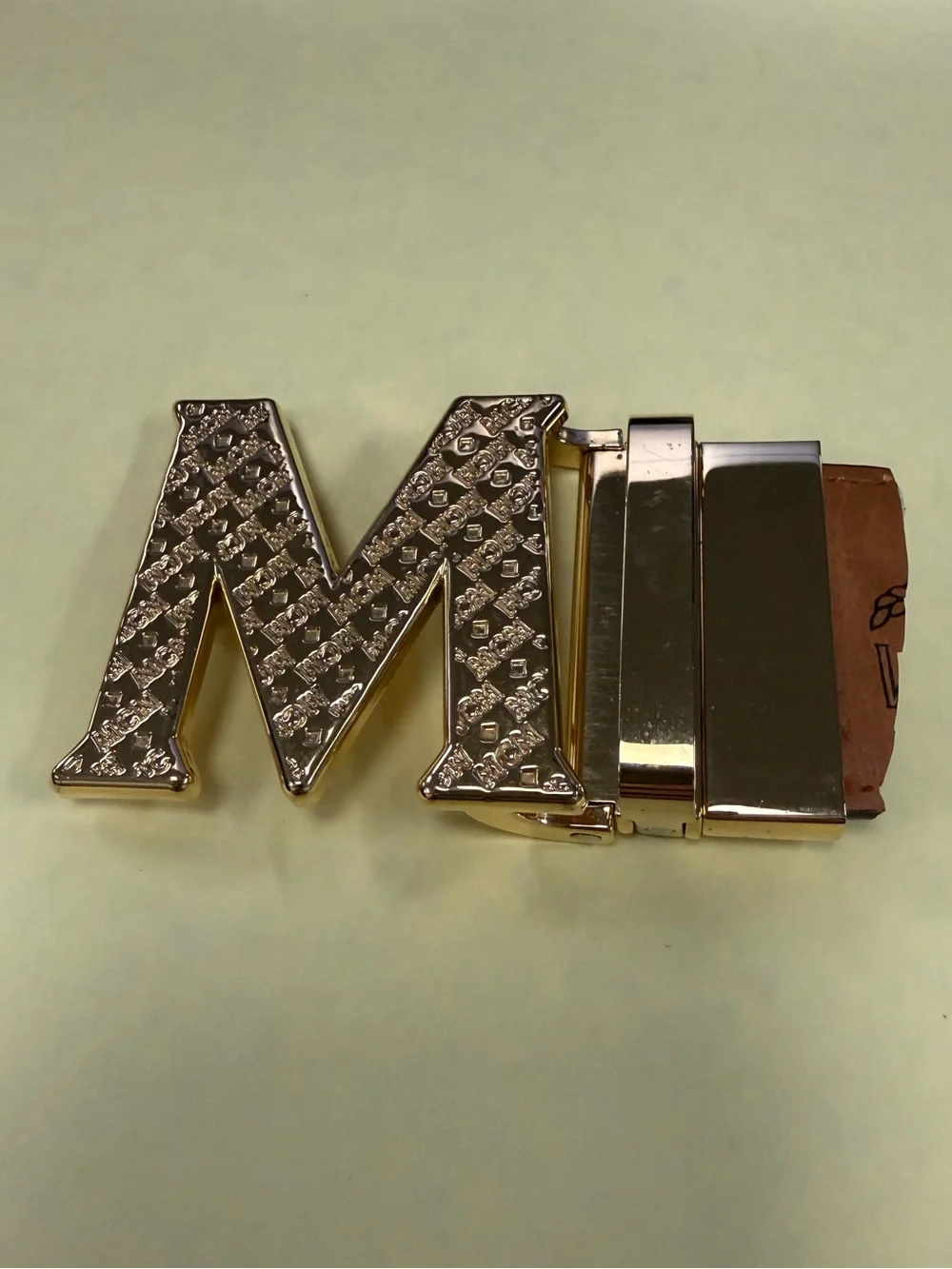 MCM Gold Tone Initial “M” Automatic Ratchet Belt Buckle Designer Logo